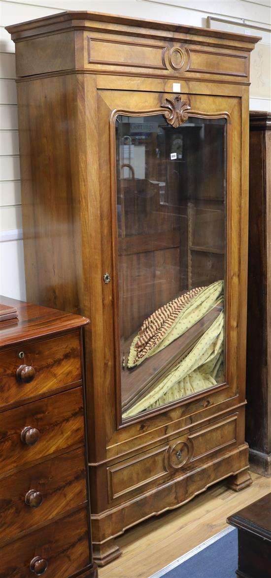 A 19th century French mahogany armoire, enclosed by a glazed door, W.106cm